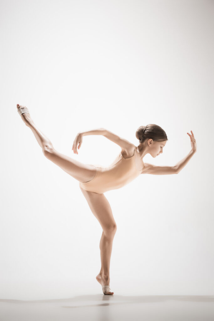 Ballet dancer performing arabesque on pointe